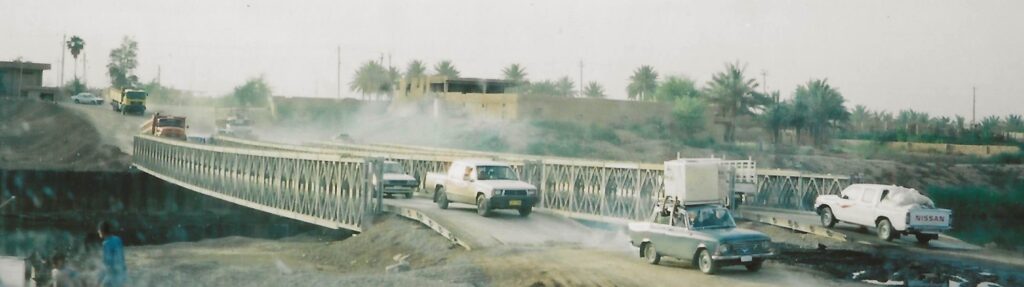 Cars crossing bridge in Southern Baghdad