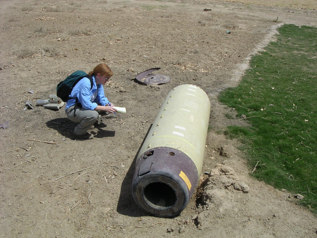 Docherty examines a cluster munition.
