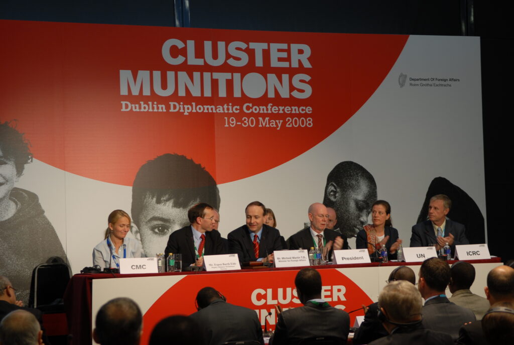Delegates applaud the adoption of the Convention on Cluster Munitions at the Dublin Diplomatic Conference.