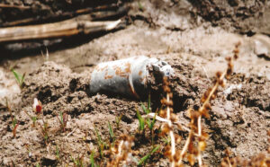 Unexploded DPICM submunition found by Human Rights Watch researchers in a field north of Baghdad, Iraq, in May 2003. Credit: Bonnie Docherty/Human Rights Watch, 2003.